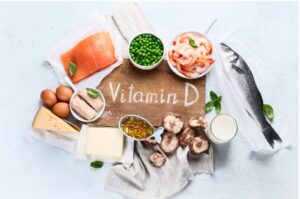 Assorted Vitamin D-rich foods on a tray, such as salmon, eggs, and mushrooms, illustrating dietary sources discussed in 'The Sunshine Vitamin: 20 Ways to Boost Your D Levels Naturally'