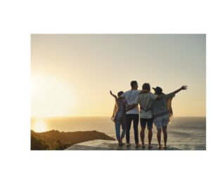 Sunset Embrace: A group of people in a warm, collective hug, gazing at a stunning sunset, illustrating the beauty of quality connections and the shared experience of life’s simple pleasures.