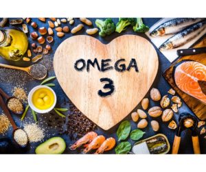 A visually appealing arrangement of Omega-3 rich foods, featuring a salmon fillet and scattered flaxseeds, symbolizing their role in promoting skin health and elasticity. Slowing Down Aging. 