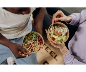 A high-quality and appetizing image showcasing a variety of vibrant and healthy ingredients, including colorful fruits and vegetables, whole grains, lean proteins, and healthy fats. The food is artistically arranged on a plate or in a cooking setting, with a bright and inviting composition that emphasizes the freshness and nutritional value of the ingredients. This image conveys the message that eating well is a crucial and enjoyable part of self-care and overall well-being. Self-Care Strategies.