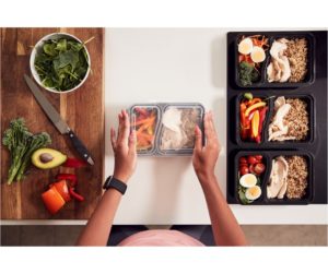 Image of a person preparing meals for the week, representing meal planning as part of the Anti-Inflammatory Diet.