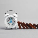 Time Hacks for Moms: A clock with blocks beside it, symbolizing the concept of time blocking for effective scheduling.