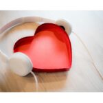 A creative depiction of a heart wearing headphones, symbolizing a love for music and its emotional impact.