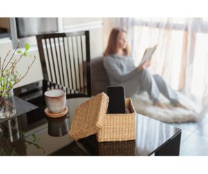 a women relaxing reading a book digital detoxing.