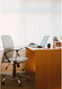 An ergonomic office chair at a desk, highlighting the importance of transforming your home office for comfort and productivity.