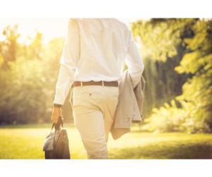 A man walking outside with a briefcase, taking a break to recharge during his workday.