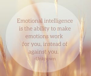 Inspirational quote on emotional intelligence overlaying a serene image of a wheat field at sunset, stating, 'Emotional intelligence is the ability to make emotions work for you, instead of against you.