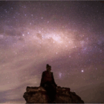 What I Hope You Feel If You're Reading This: A woman sits wrapped in a blanket under a starry sky, surrounded by stillness and the quiet strength of healing.